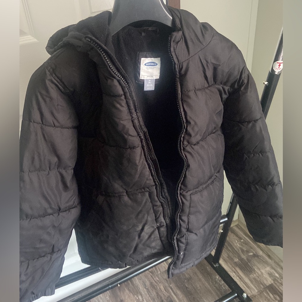 Black old navy puffer jacket. Well insulated.